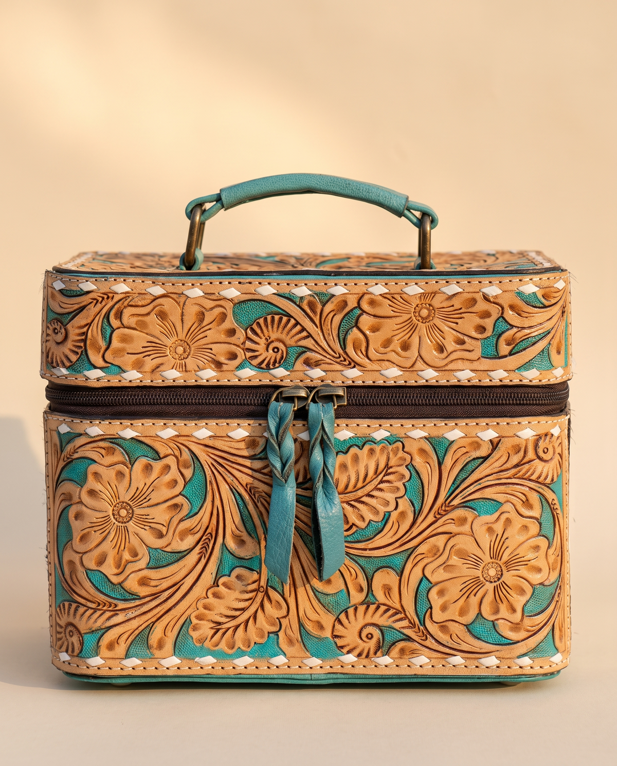 Turquoise hand-tooled leather vanity case with cowhide sides, front view, by Ya Qalbi
