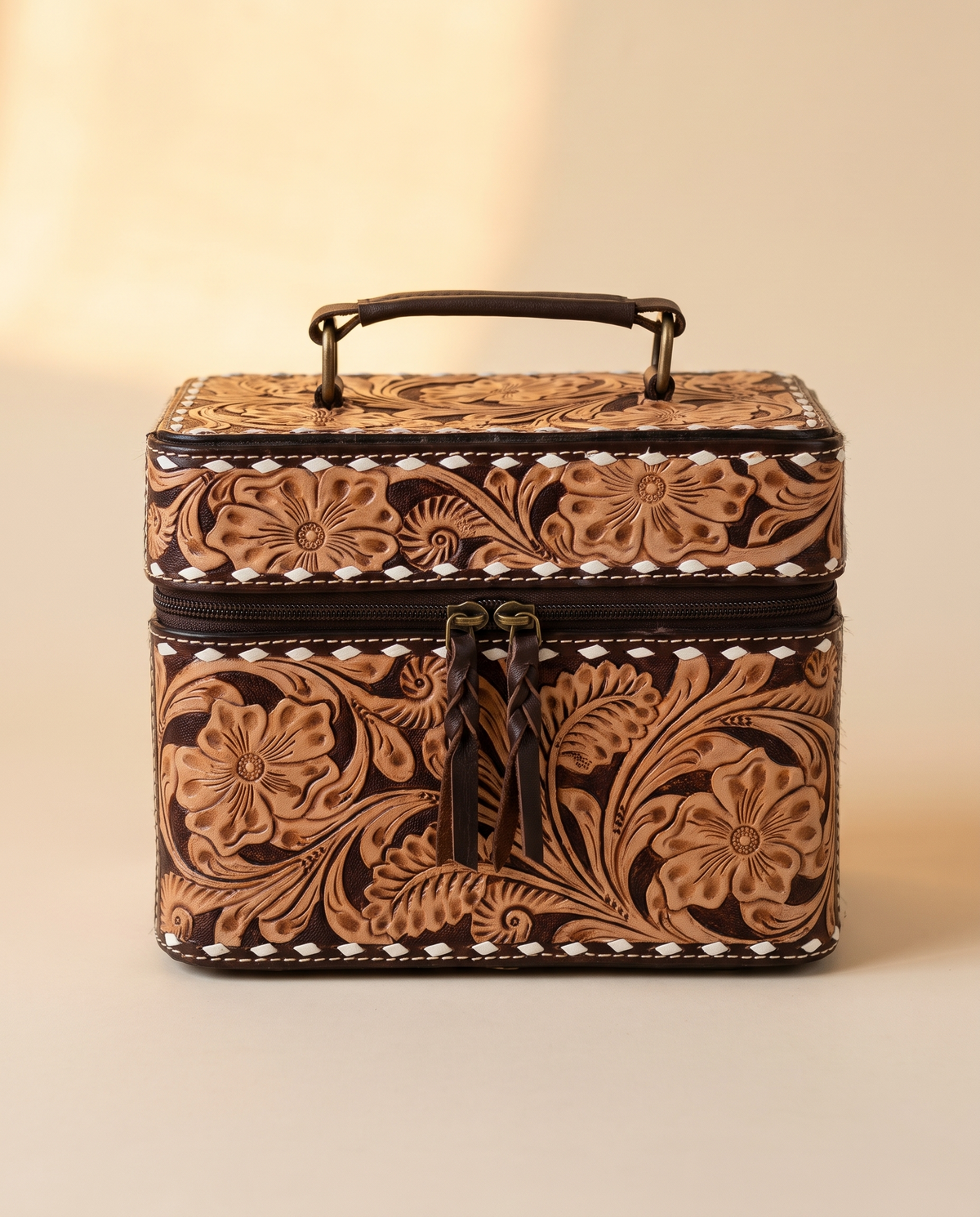 Brown hand-tooled leather vanity case with cowhide sides, front view, by Ya Qalbi