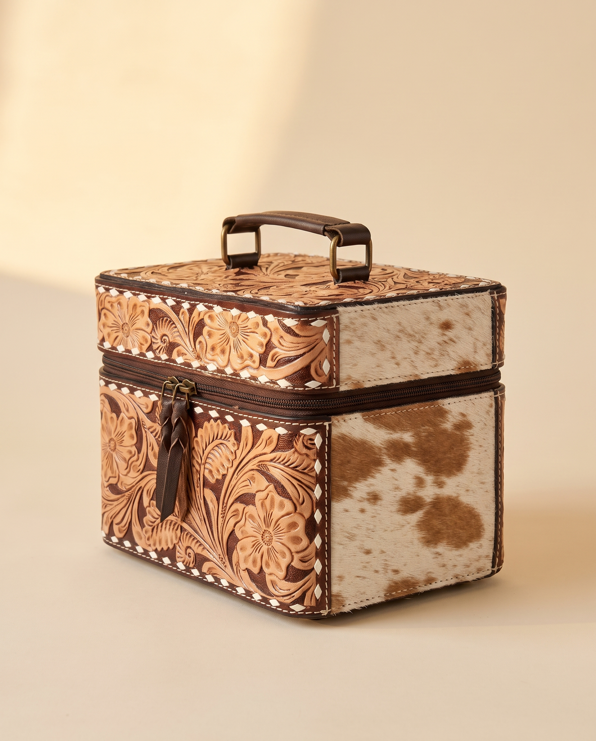 Brown hand-tooled leather vanity case with cowhide sides, angled view, by Ya Qalbi