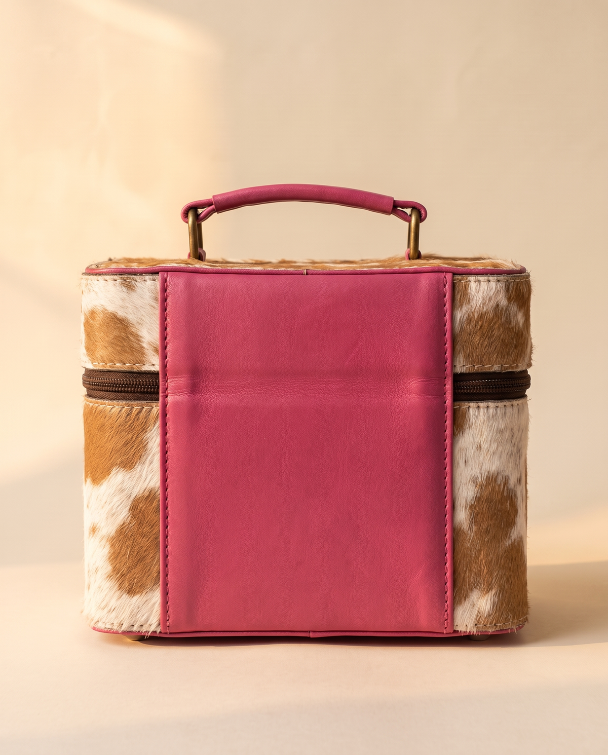 Pink hand-tooled leather vanity case with cowhide sides, detail close-up, by Ya Qalbi