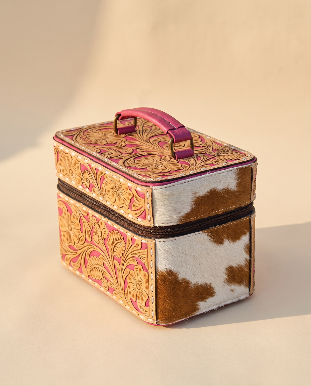 Pink hand-tooled leather vanity case with cowhide sides, angled view, by Ya Qalbi