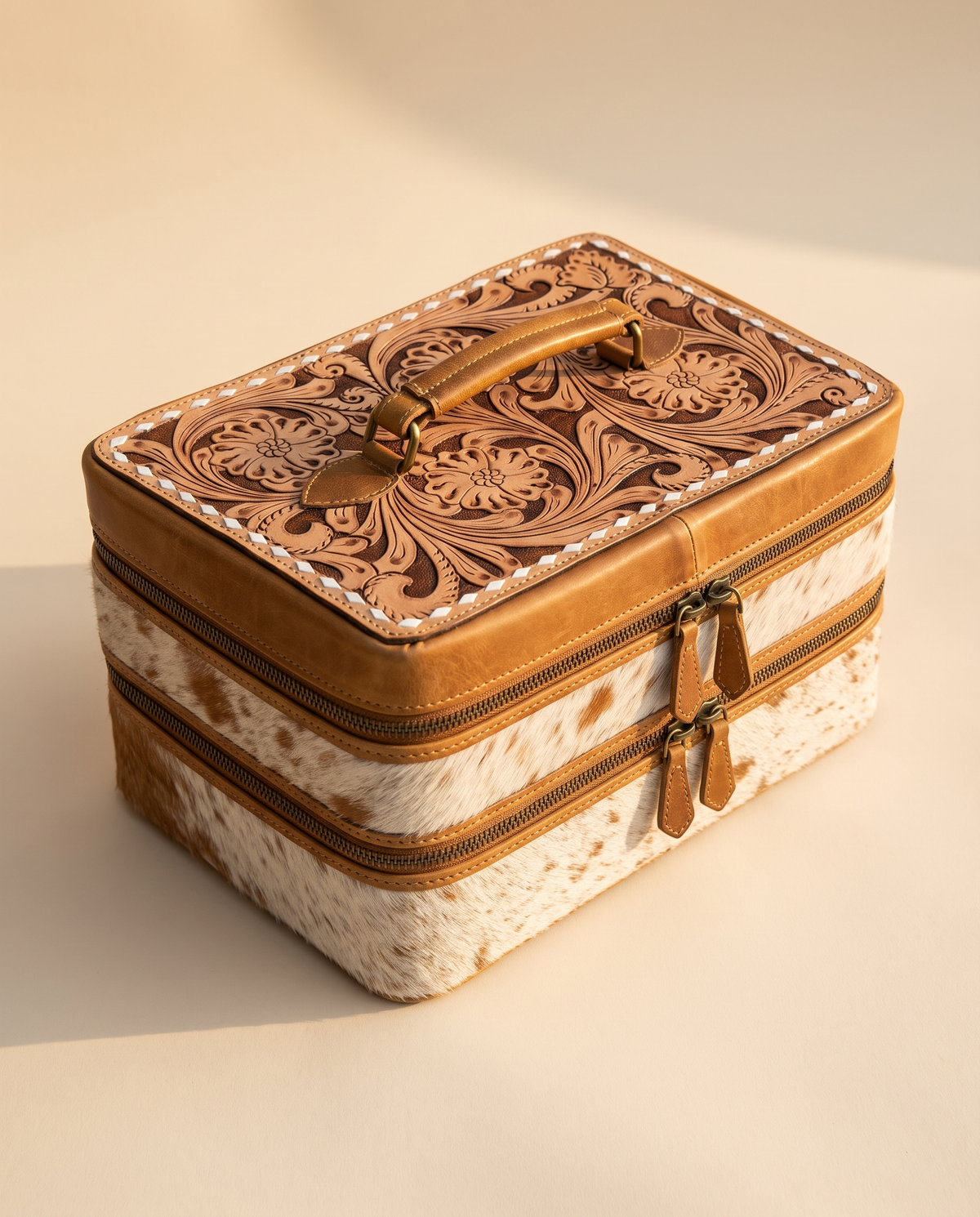 Two-tier cowhide jewellery case with hand-tooled lid, angled view, by Ya Qalbi