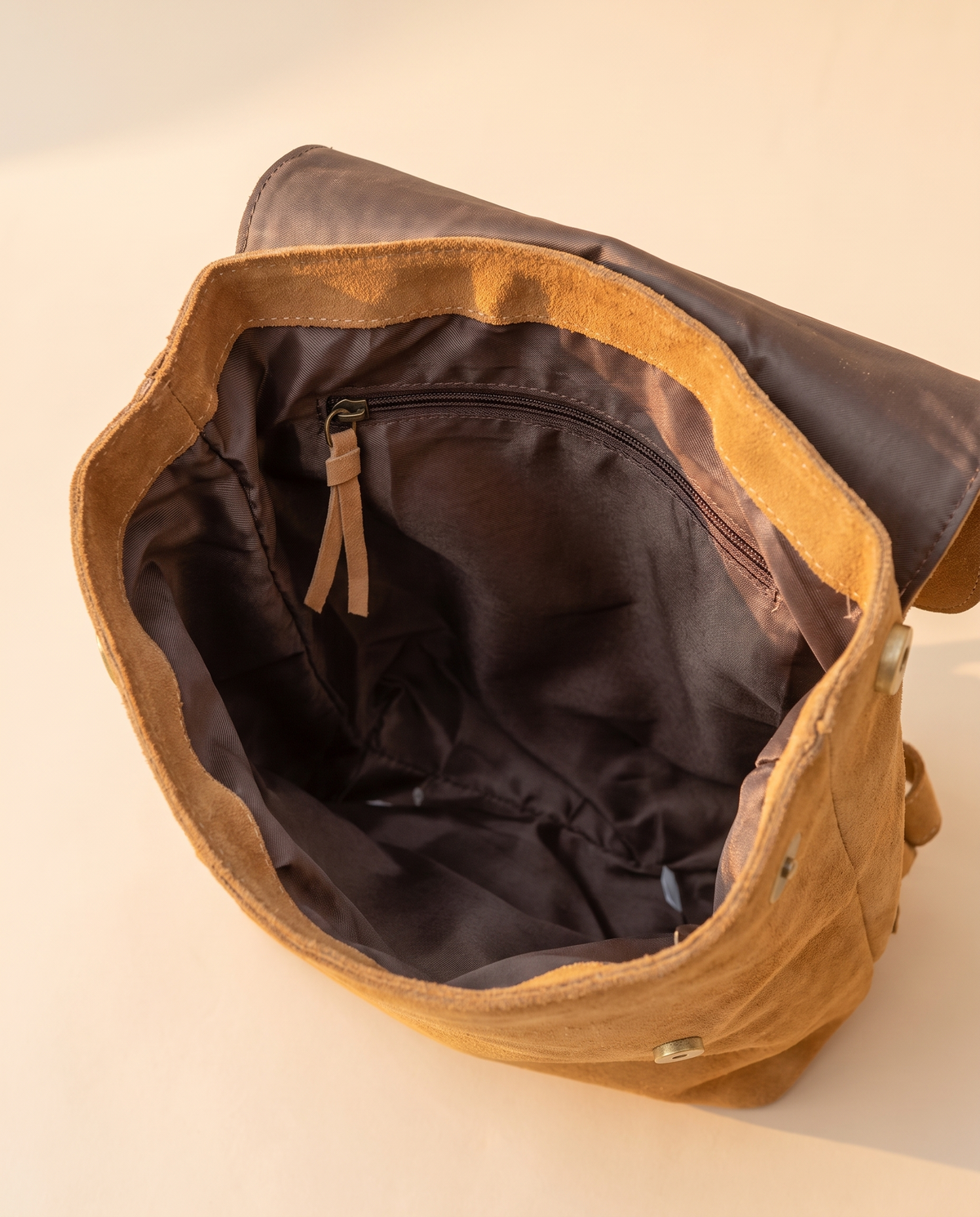 Tan suede drawstring backpack interior