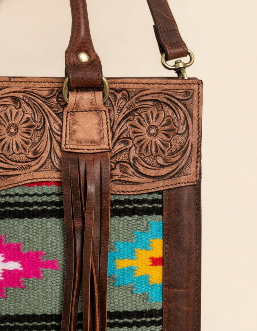 Grey and pink serape fringe tote with tooled leather top, tooled top and fringe close-up, by Ya Qalbi