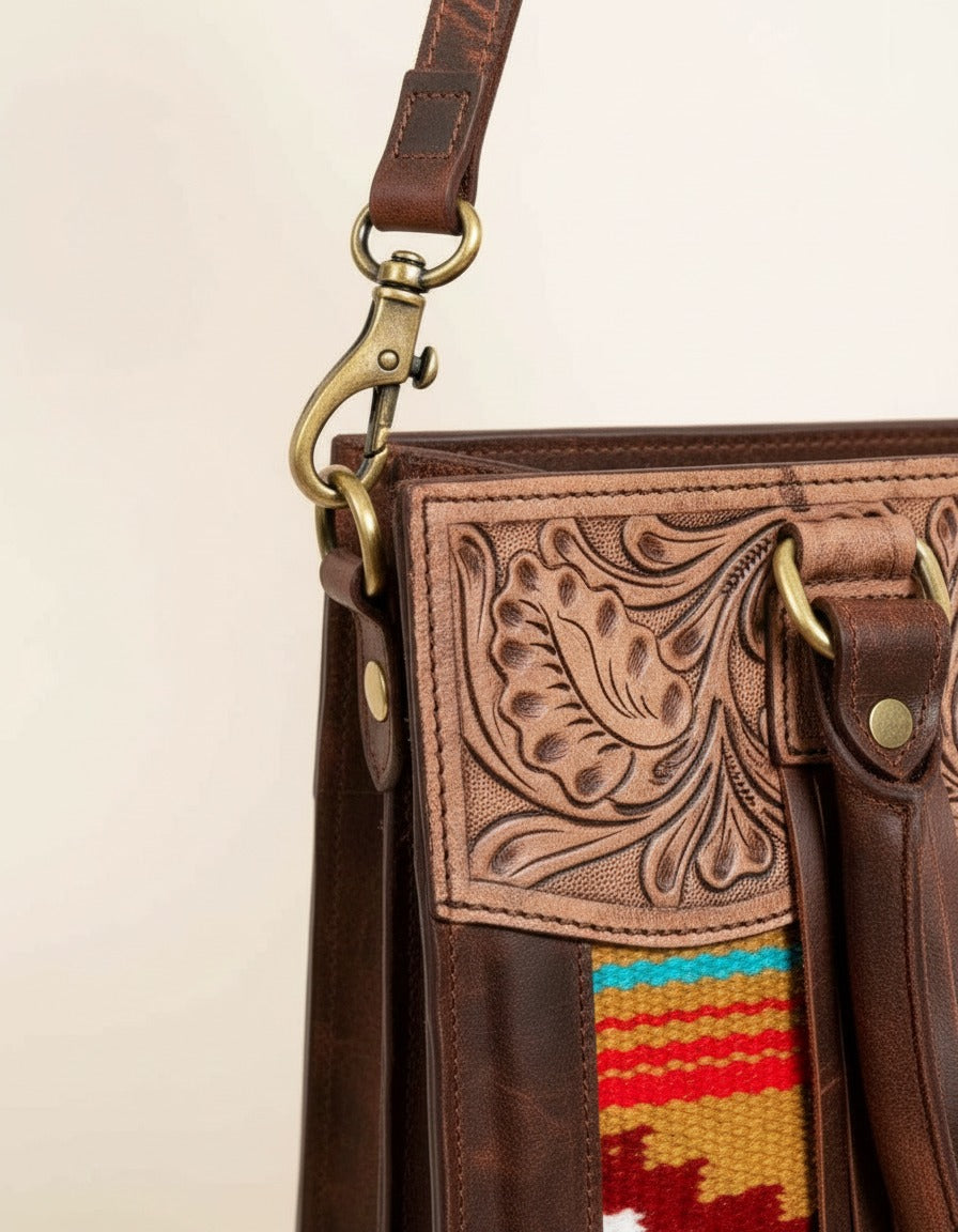 Orange serape fringe tote with tooled leather top, strap clip close-up, by Ya Qalbi