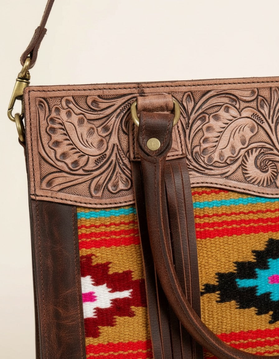 Orange serape fringe tote with tooled leather top, tooled top and fringe close-up, by Ya Qalbi