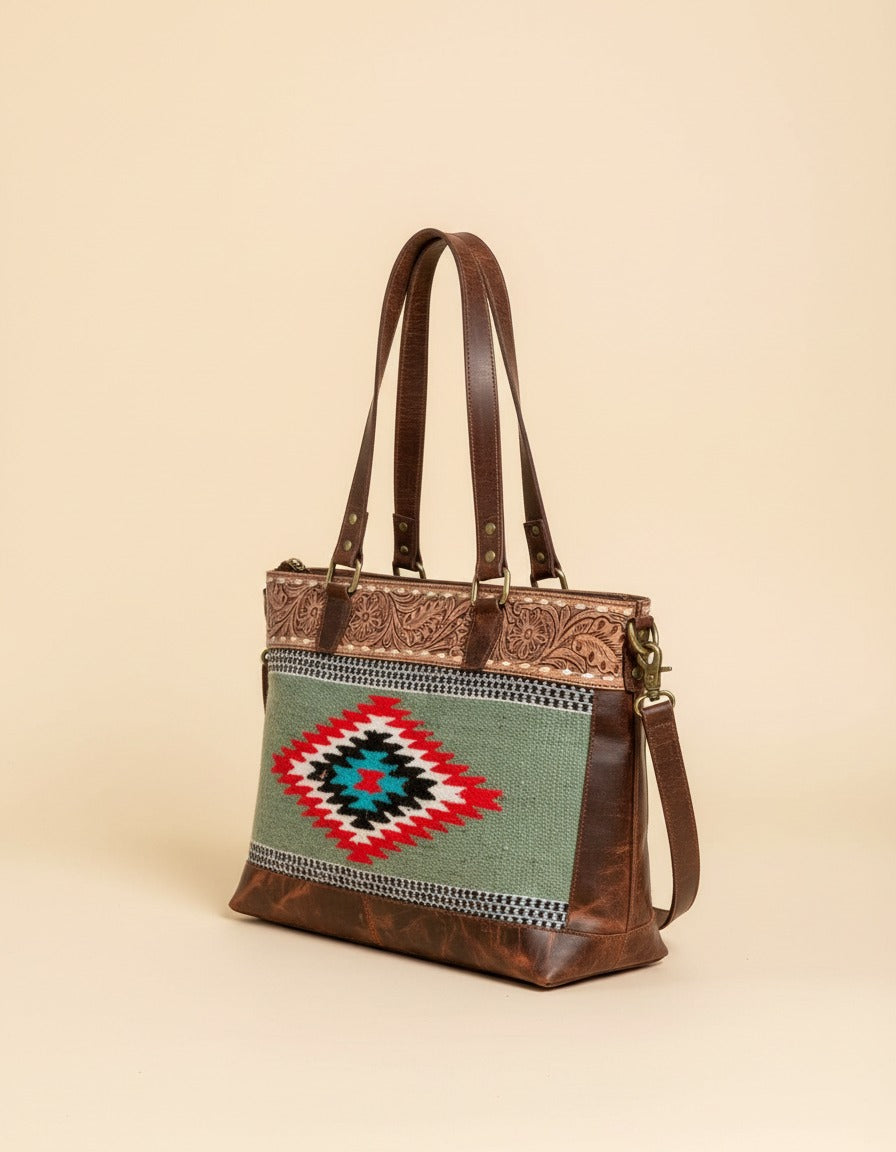 Sage serape woven zip tote with tooled leather band, angled view, by Ya Qalbi