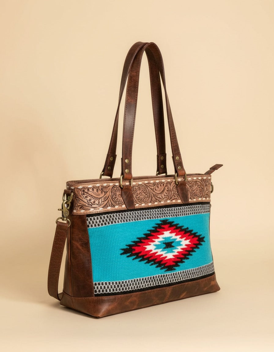 Turquoise serape woven zip tote with tooled leather band, angled view, by Ya Qalbi