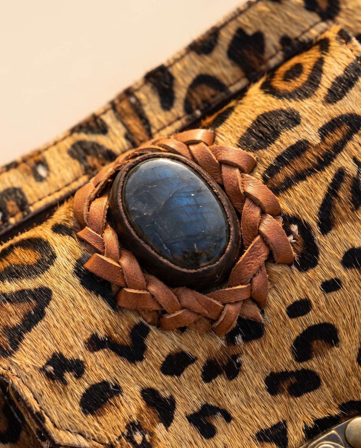 Leopard suede hip bag with stone and clasp, detail close-up, by Ya Qalbi