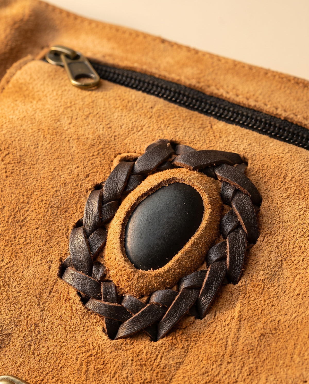Tan suede hip bag with stone and clasp, detail close-up, by Ya Qalbi