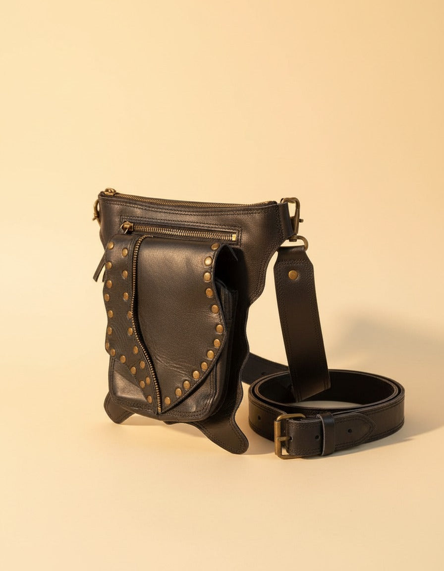 Black studded leather hip belt bag, angled view, by Ya Qalbi