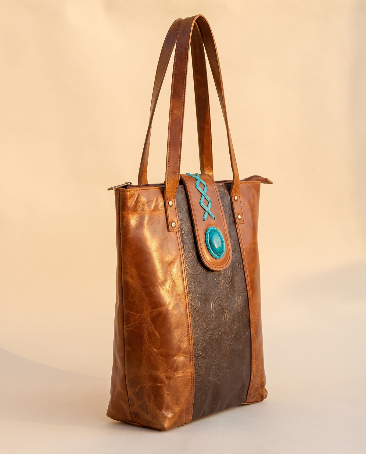 Dark brown panel crunch leather tote with turquoise stone, angled view, by Ya Qalbi
