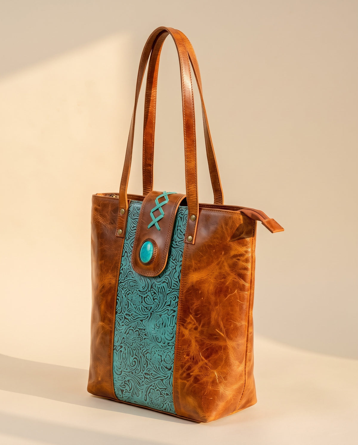 Turquoise embossed crunch leather tote with turquoise stone, angled view, by Ya Qalbi
