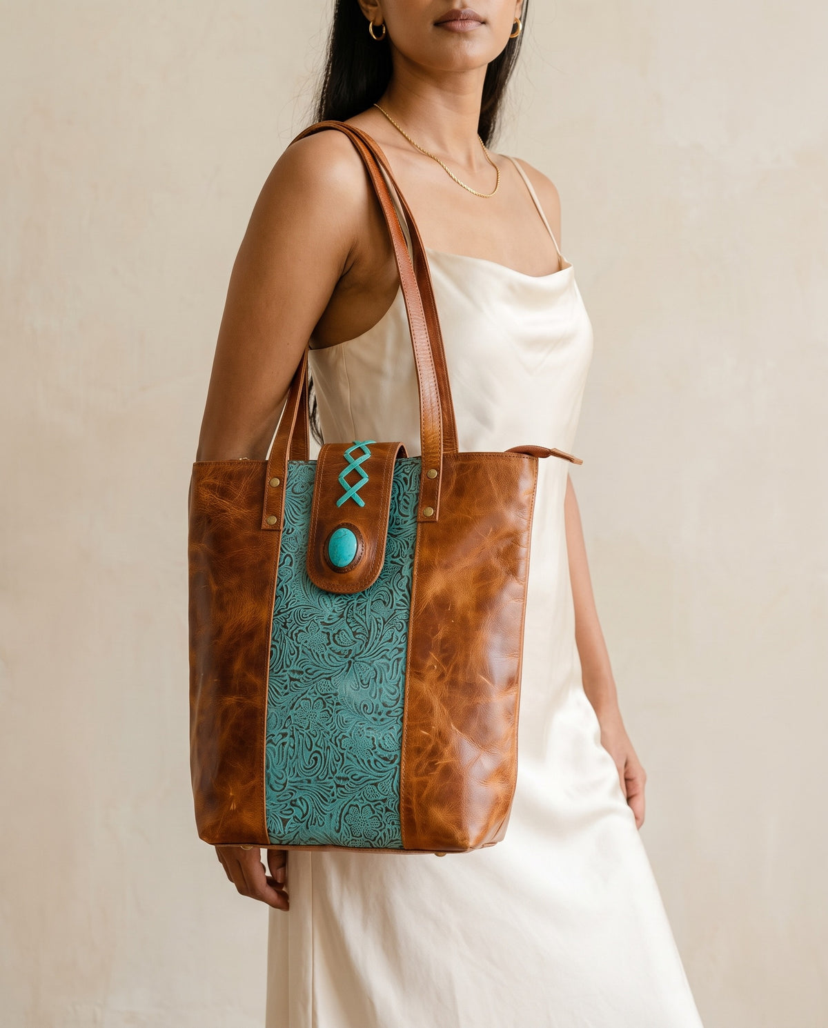Turquoise embossed crunch leather tote with turquoise stone, worn on the shoulder, by Ya Qalbi